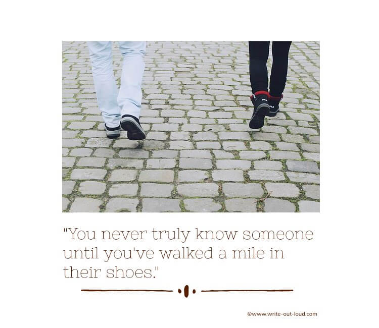 The legs and feet of two people walking on cobbles with text: You never truly know someone until you've walked a mile in their shoes.